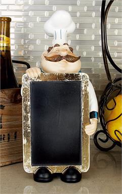 Chef with a white uniform and blue neckerchief holding a black chalkboard.