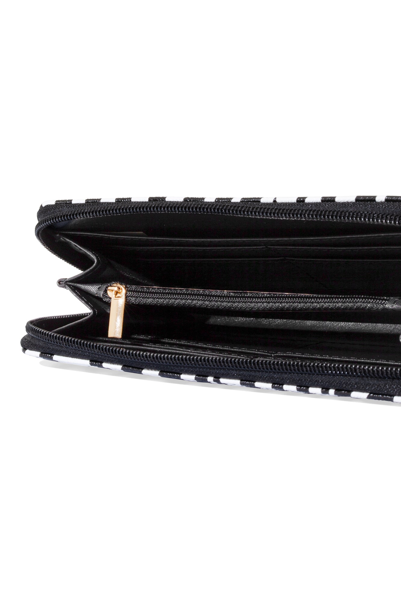 Black interior of zebra print zippered wallet with gold zips