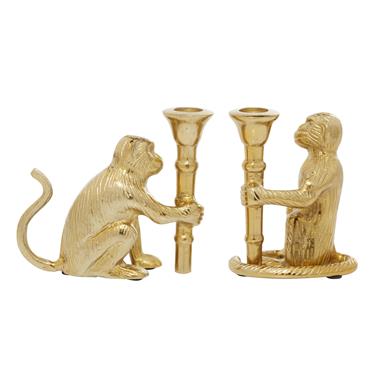 Glam gold monkey candlestick holder with detailed characteristics like facial features and fur texture.