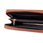 Black interior of tan wallet with multiple compartments