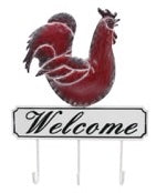 Red metal rooster atop a black and white welcome sign with three hooks