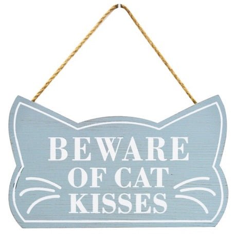 Wooden "Beware of Cat Kisses" wall plaque with a light blue background and white writing