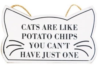 "Cats Are Like Potato Chips You Can't Have Just One" sign in shape of cat head with whiskers