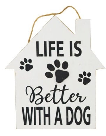 "Life Is Better With A Dog" wood house-shaped sign on a rope with a white background, black writing and paw prints