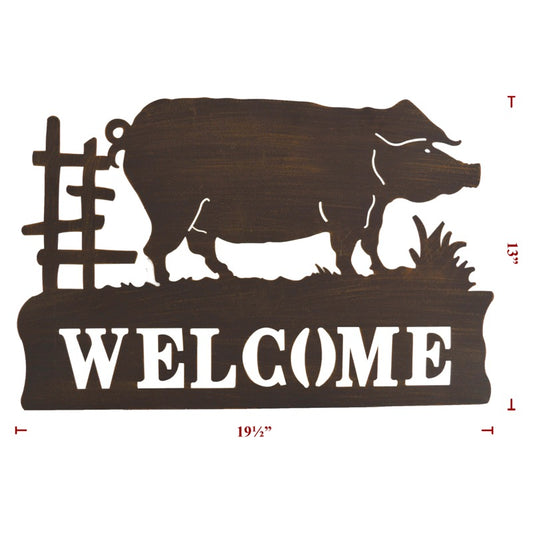 Pig on metal welcome sign with grass and a fence 
