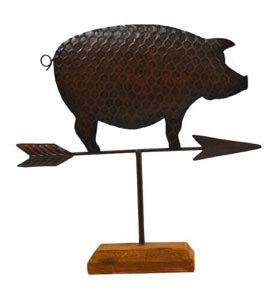 Pig on a weathervane arrow mounted on wood stand